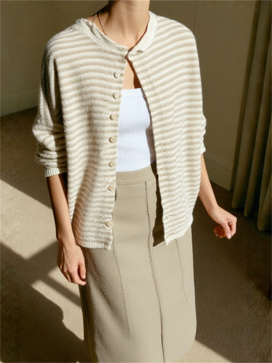 Woman wearing a striped knit cardigan